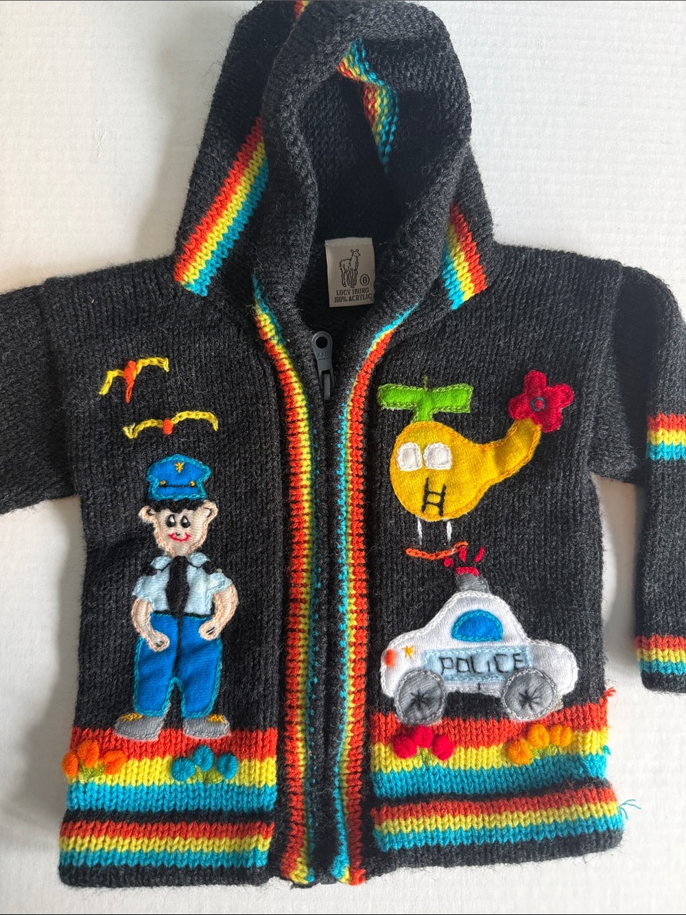 Lucy Iburg handmade Peruvian knit sweater with police theme